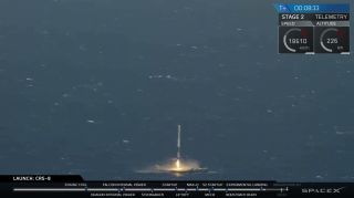Falcon 9 rocket landing on barge, flames
