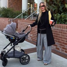 Ailie Smith with a baby stroller.