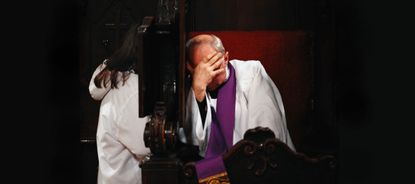 Catholic priest at confession.