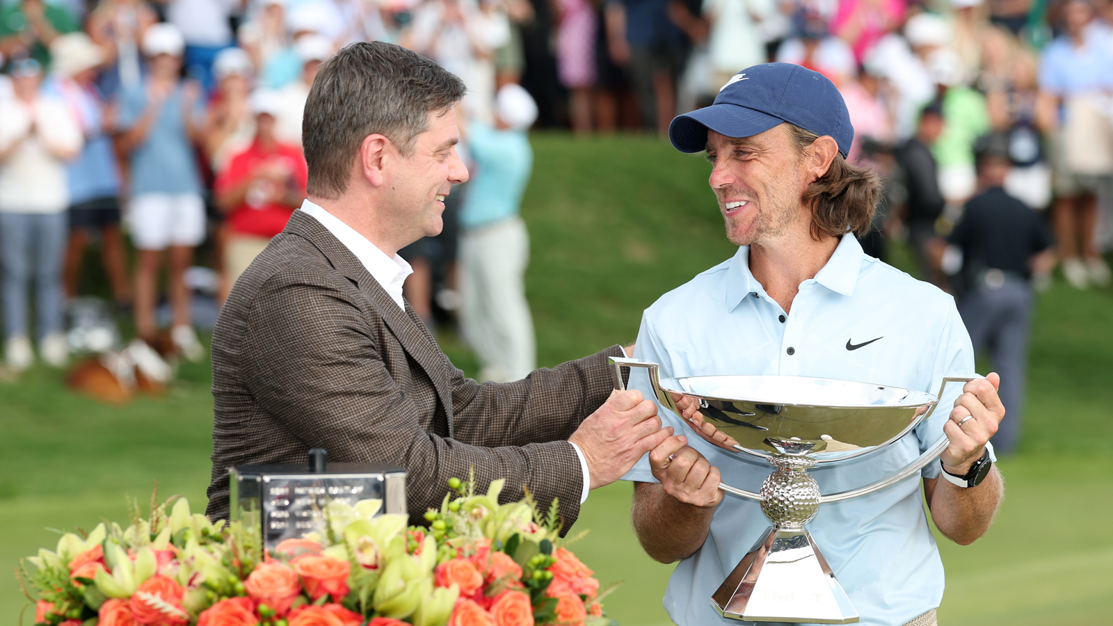 Brian Rolapp hands Tommy Fleetwood the FedEx Cup
