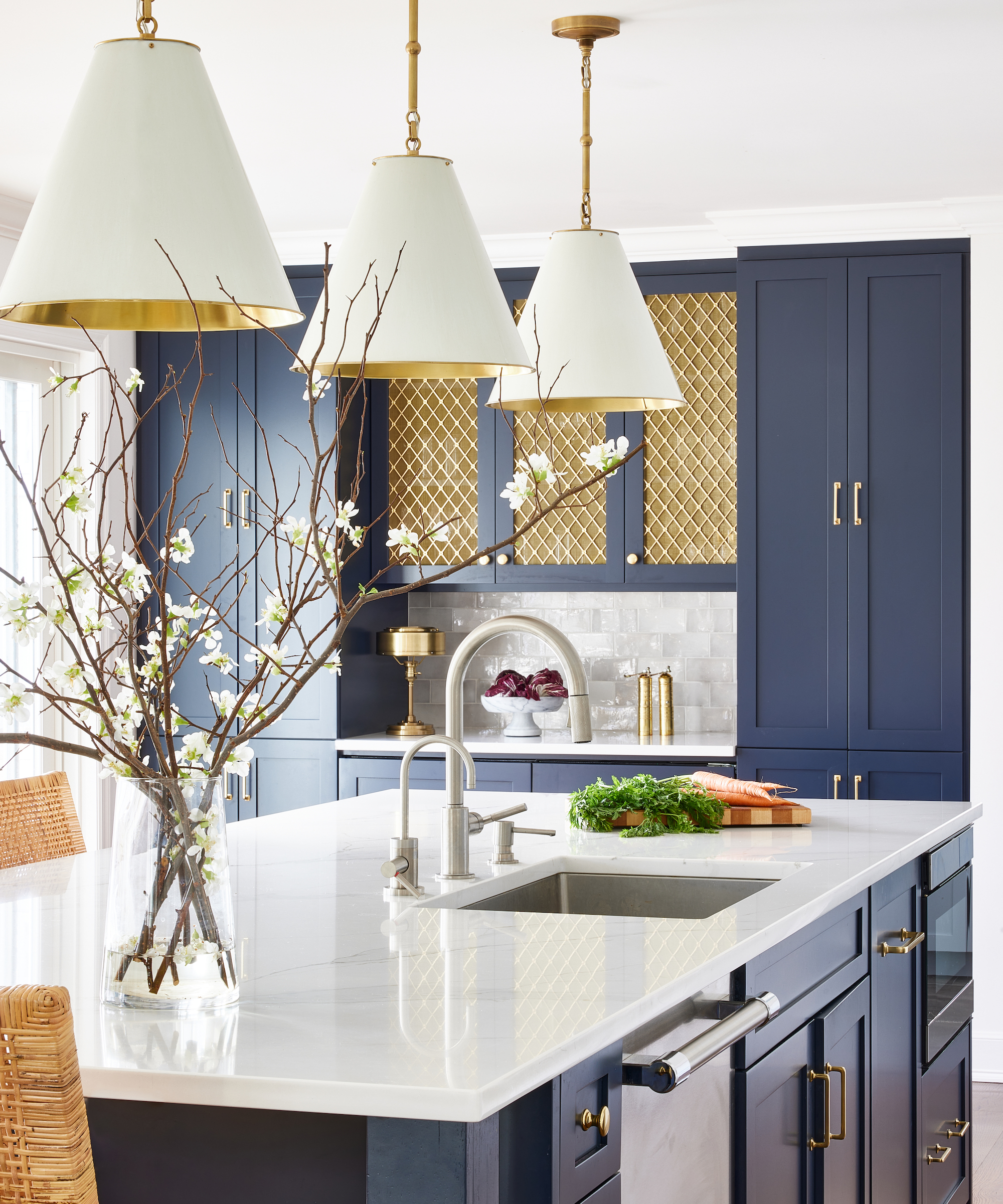 blue kitchen with white countertops