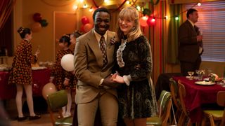 Cyril and Rosalind looking happy as they pose together at Nancy and Roger's wedding