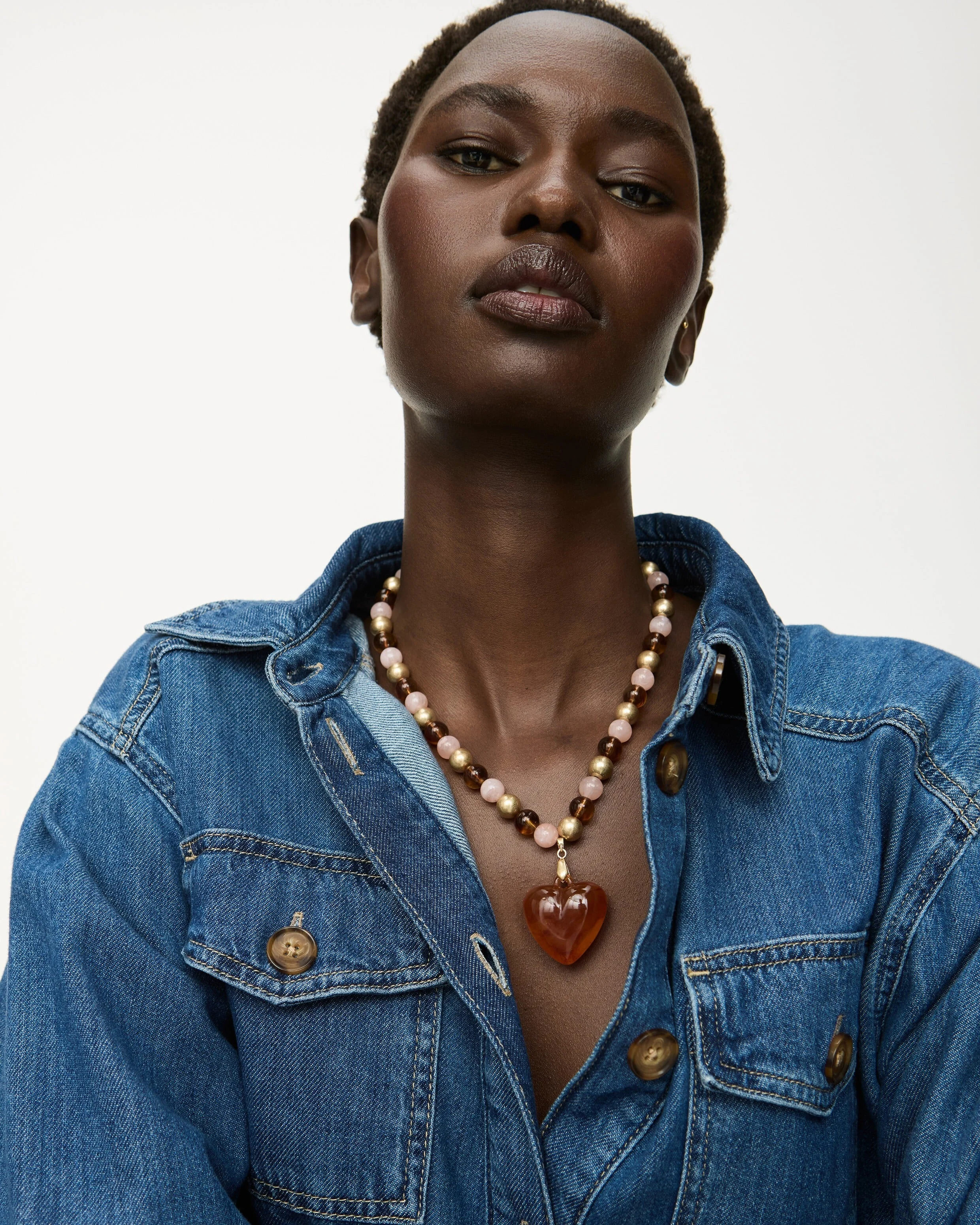 A model wears a beaded necklace.