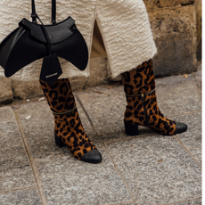 woman wearing cheeatah-printed boots