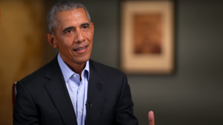 Barack Obama sits wearing a suit for an interview with 60 Minutes.