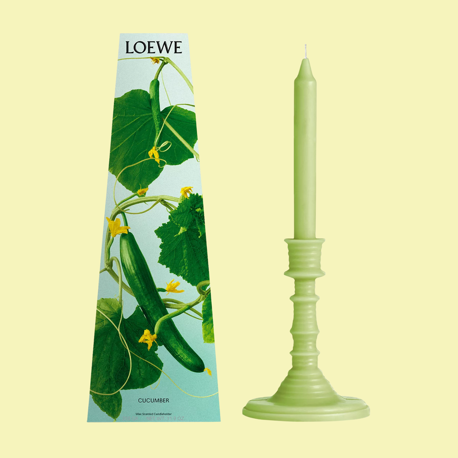 A tapered cucumber scented candle