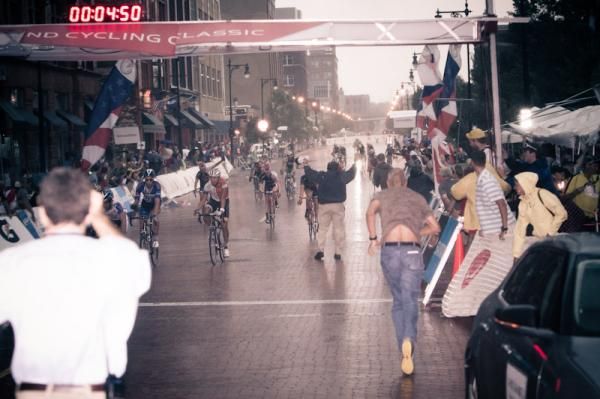 The men are ushered off the storm-battered course.
