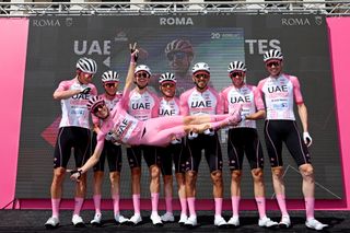 Tadej Pogačar and his team celebrate at the team presentation before the start of stage 21 of the Giro d'Italia 2024