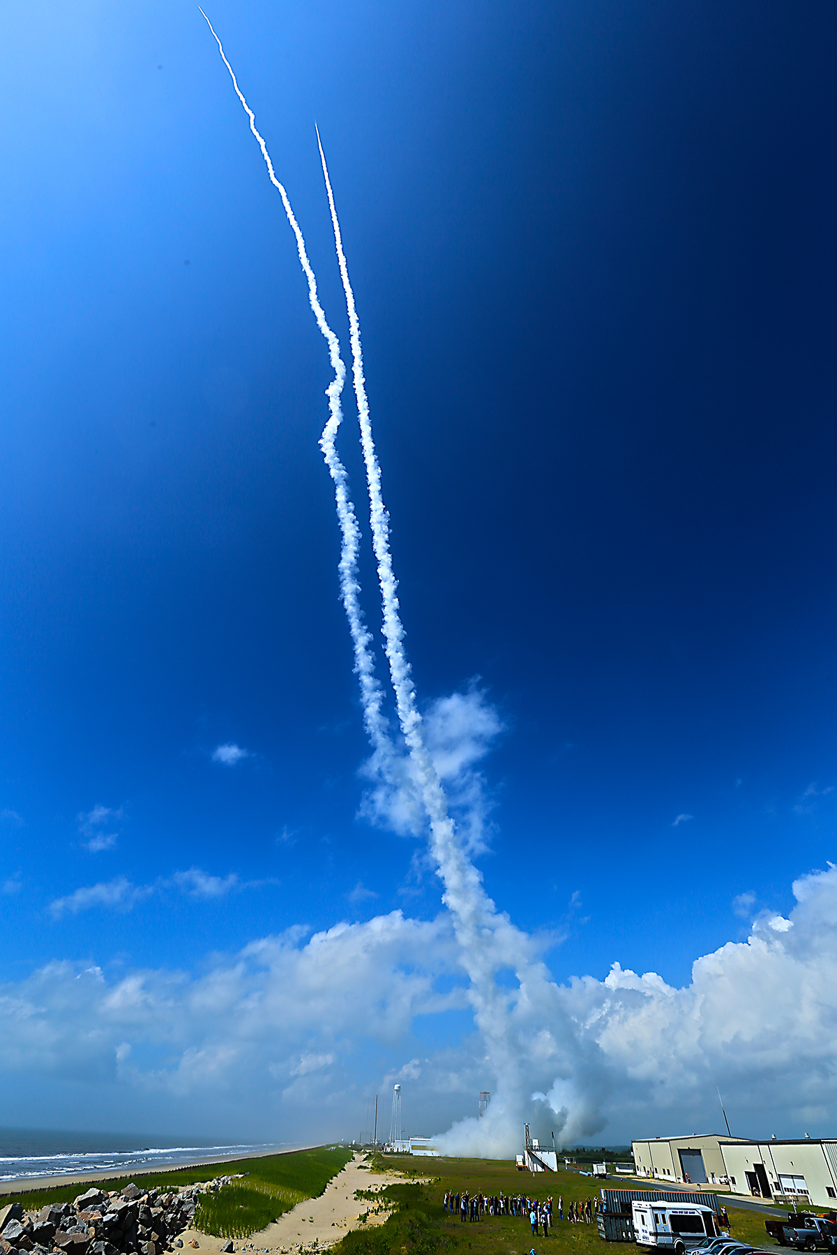 Contrails line the sky over Wallops Island, Va., on July 4, 2013 after two sounding rockets launched 15 seconds apart as part of the Daytime Dynamo experiment. A NASA Black Brant V was launched at 10:31:25 a.m. and was followed 15 seconds later by a Terrier-Improved Orion.