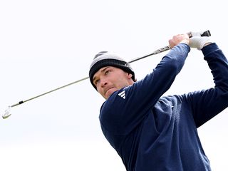 Rasmus Højgaard in the finish position after hitting an iron shot