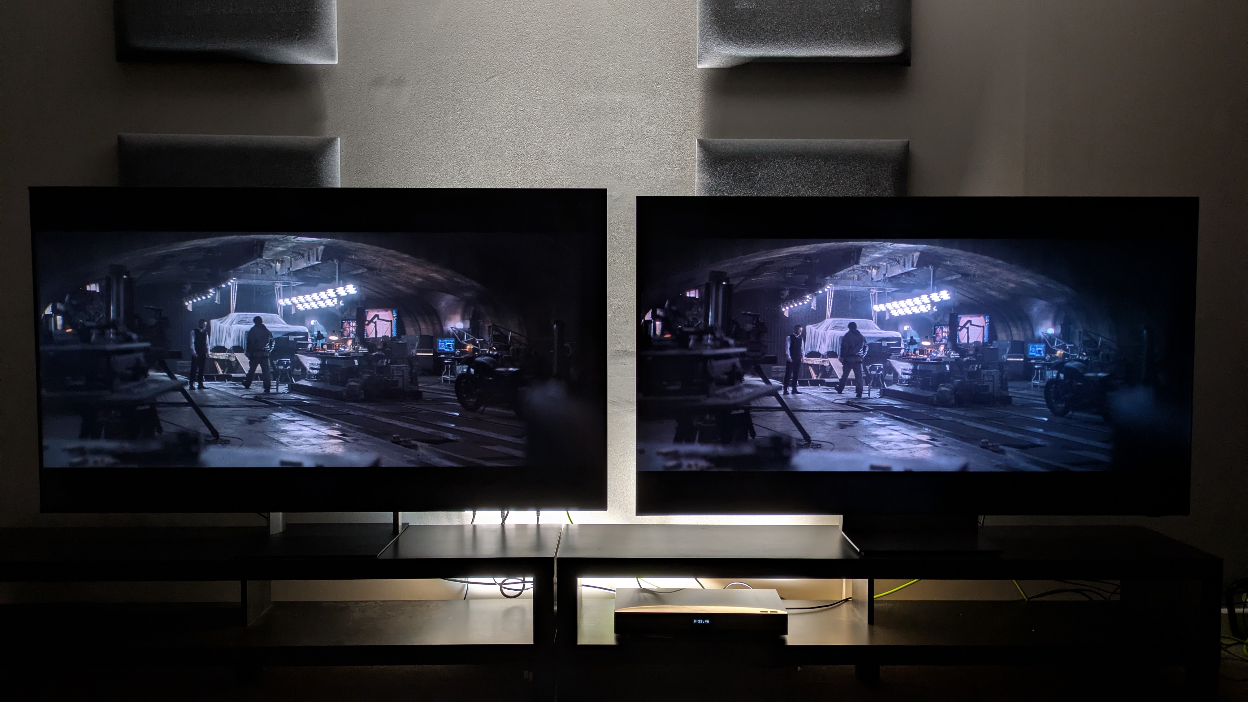 Sony Bravia 7 II (left) vs Samsung R95H (right) showing The Batman on screen. Both TVs show good balance between light and dark tones, but the R95H has the punchier bright tones.