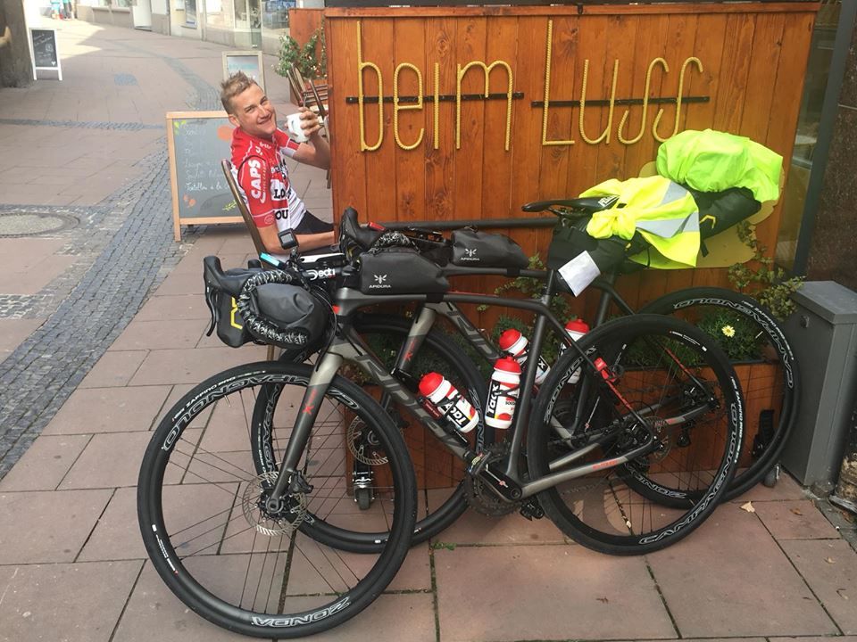 A happy Tim Wellens with a cup of coffee