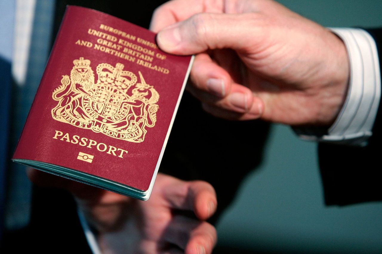 Passport warning WASHINGTON - OCTOBER 24: A new British biometric European Union passport, which is embedded with a microchip, is shown during a news briefing at the British Embassy October 24, 2005 in Washington, DC. &quot;The new British biometric passport contains features such as an enhanced security chip which will help to make international travel as safe and efficient as possible,&quot; said British Ambassador to the United States, Sir David Manning. (Photo by Alex Wong/Getty Images)