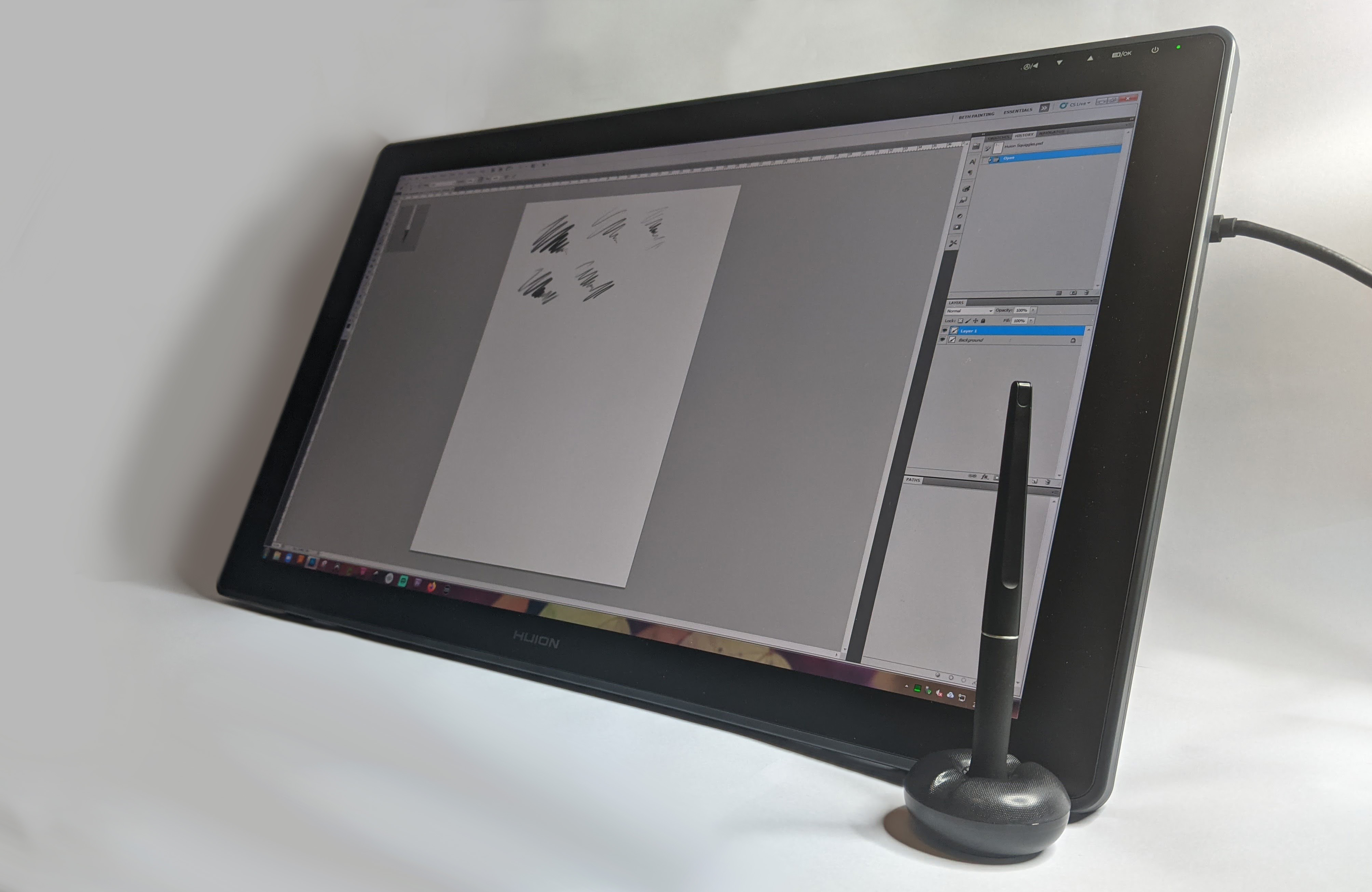 The best tablets with a stylus pen, a Huion Kamvas 24 Series on a white background displaying Photoshop