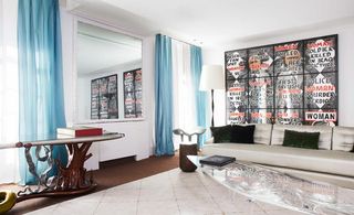 David Gill Gallery art director Francis Sultana's living room includes artworks by Gilbert & George, and a table by Zaha Hadid