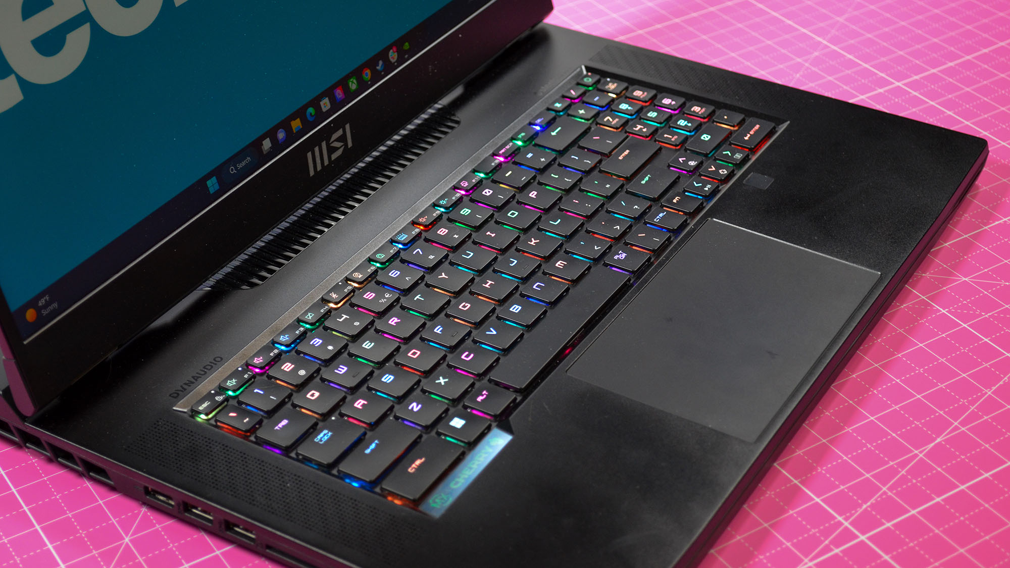 An MSI GT77 Titan on a pink desktop mat