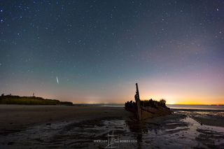 An Orionid meteor passes over the Atlantic Ocean near the New Jersey coast just before sunrise on Oct. 21.