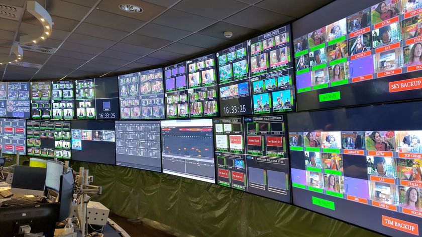 The control room at Mediaset S.p.A with ton of TVs.