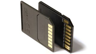 Image showing an SD card next to an MMC card for comparison