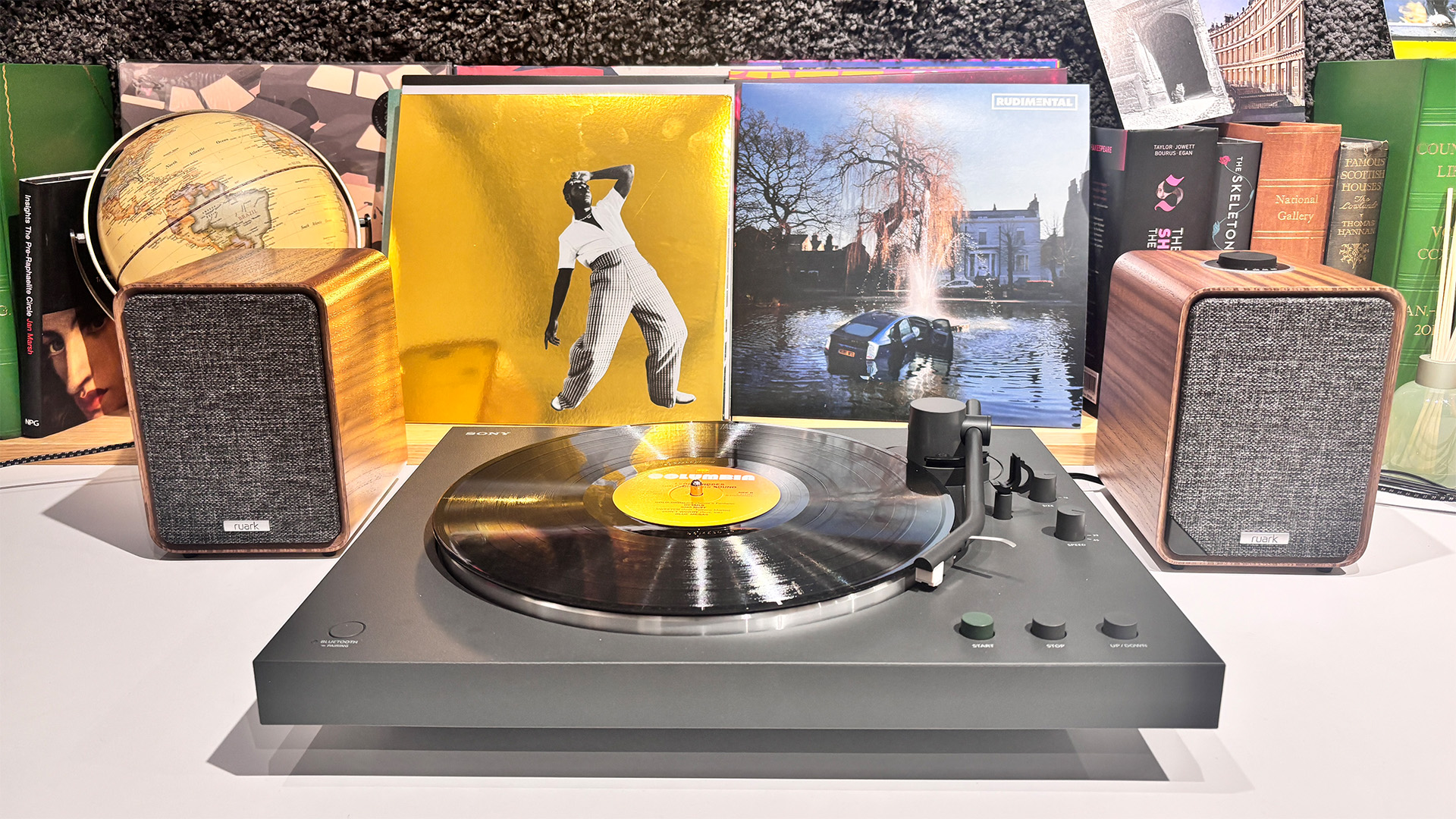 Sony PS-LX3BT Bluetooth turntable on white desk with Ruark MR1 Mk3 powered speakers