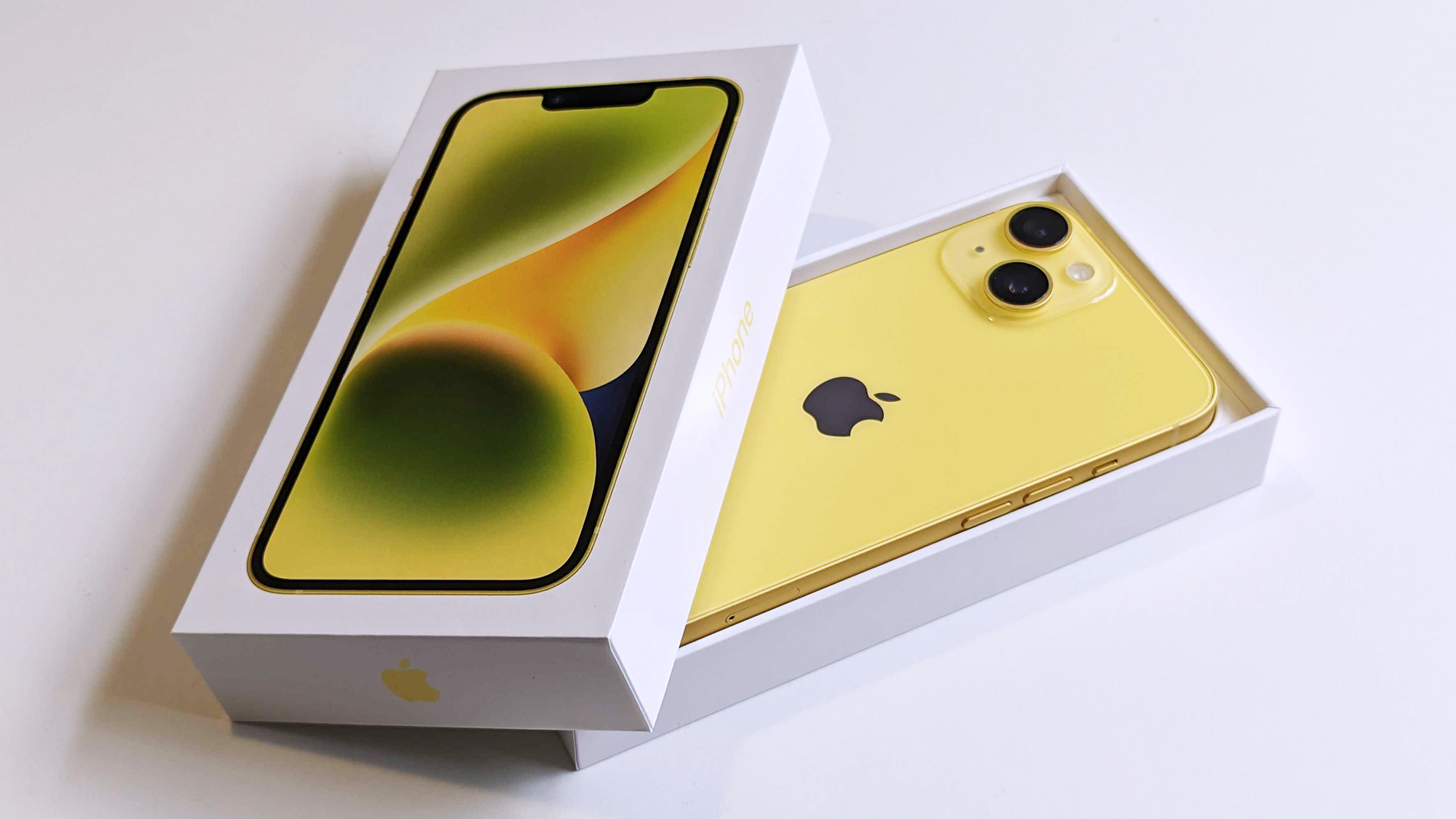 Apple iPhone 14 yellow unboxing partially open