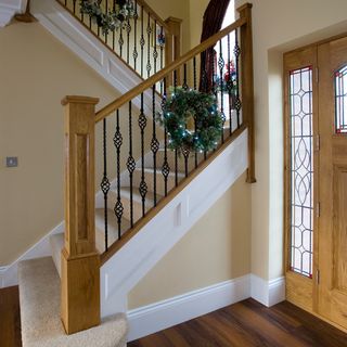 hallway with stairs and wooden flooring