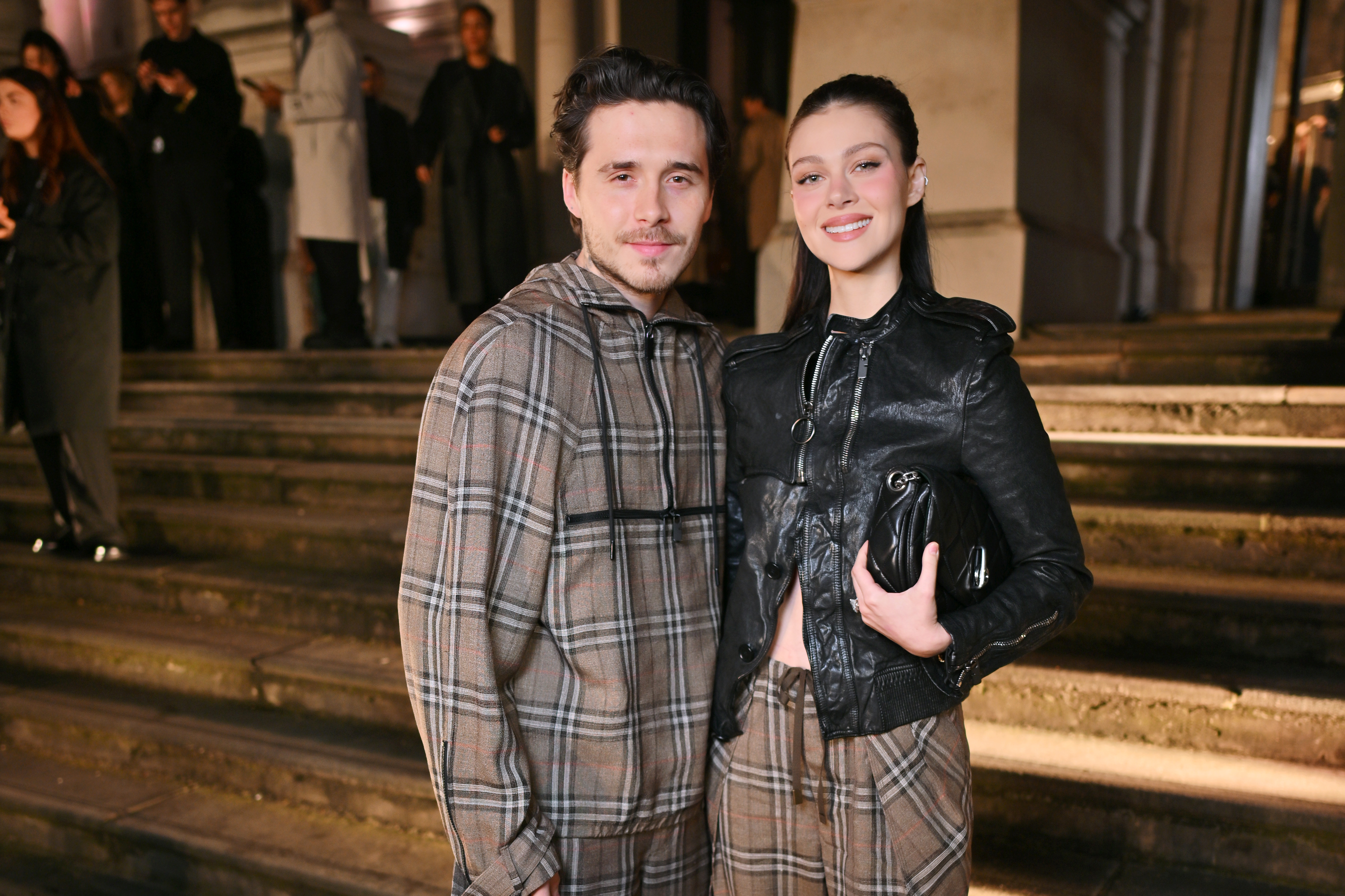 Brooklyn Beckham and Nicola Peltz at the Burberry Winter 2025 show during London Fashion Week.