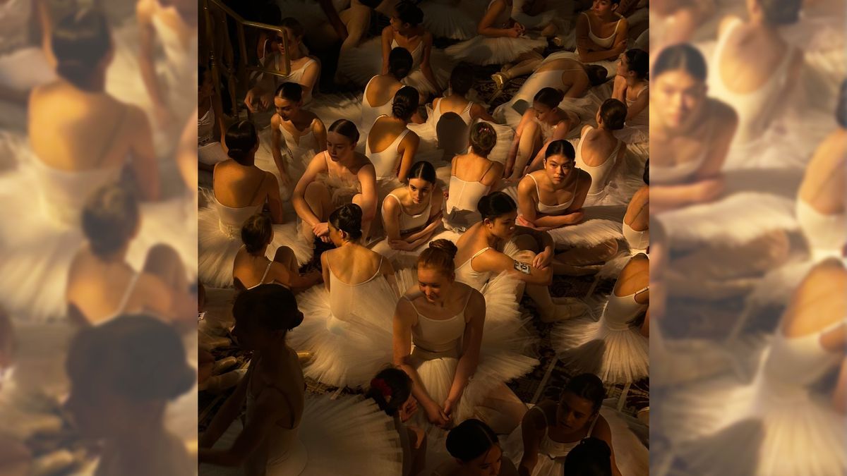 Photo of ballerinas sitting on the floor