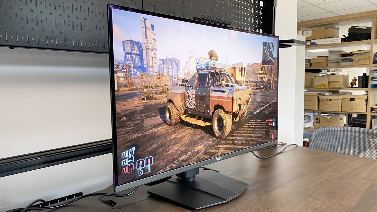 MSI MPG321URX on top of a wooden table