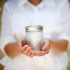 Woman holding mason jar