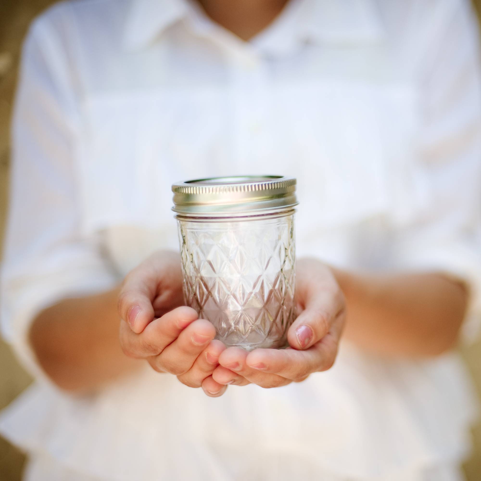Woman holding mason jar