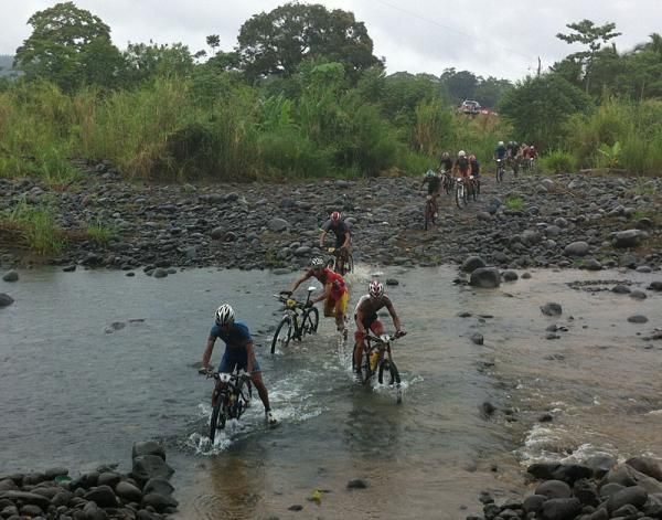 The lead men through a stream crossing five minutes into the race