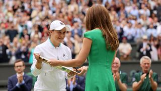 london, england july 10 ashleigh barty of australia is presented with the venus rosewater dish trophy by hrh catherine, the duchess of cambridge after winning her ladies singles final match against karolina pliskova of the czech republic on day twelve of the championships wimbledon 2021 at all england lawn tennis and croquet club on july 10, 2021 in london, england photo by clive brunskillgetty images