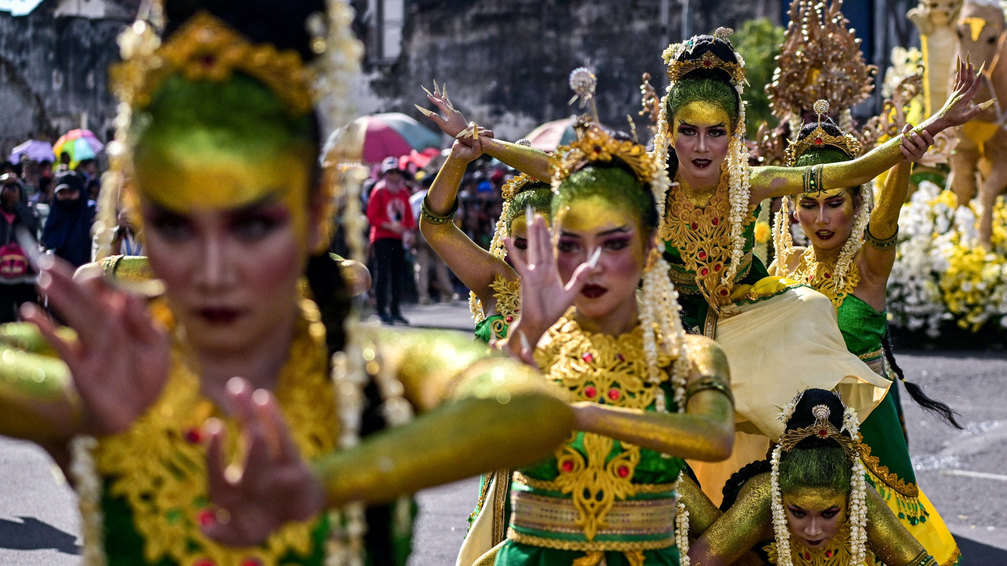 Performers dance during a parade
