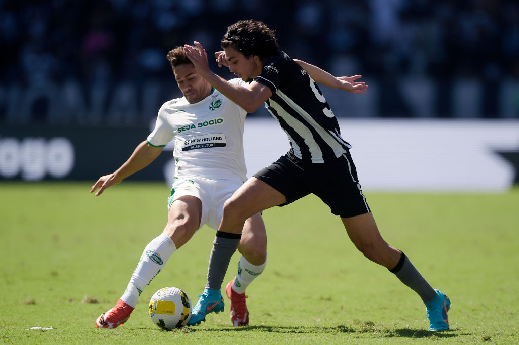 Matheus Nascimento (L) of Botafogo competes for the ball with Romulo of Juventude during the match between Botafogo and Juventude as part of Brasileirao Series A 2022 at Nilton Santos Stadium on May 1, 2022 in Rio de Janeiro, Brazil.