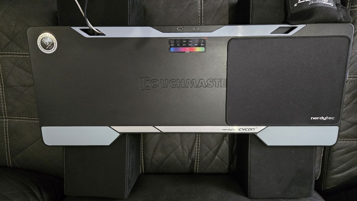 Couchmaster Cycon3 set-up on a sofa with a keyboard and mouse.