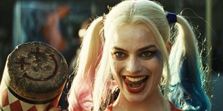 Harley Quinn licks her teeth while holding a mallet in 'Suicide Squad'