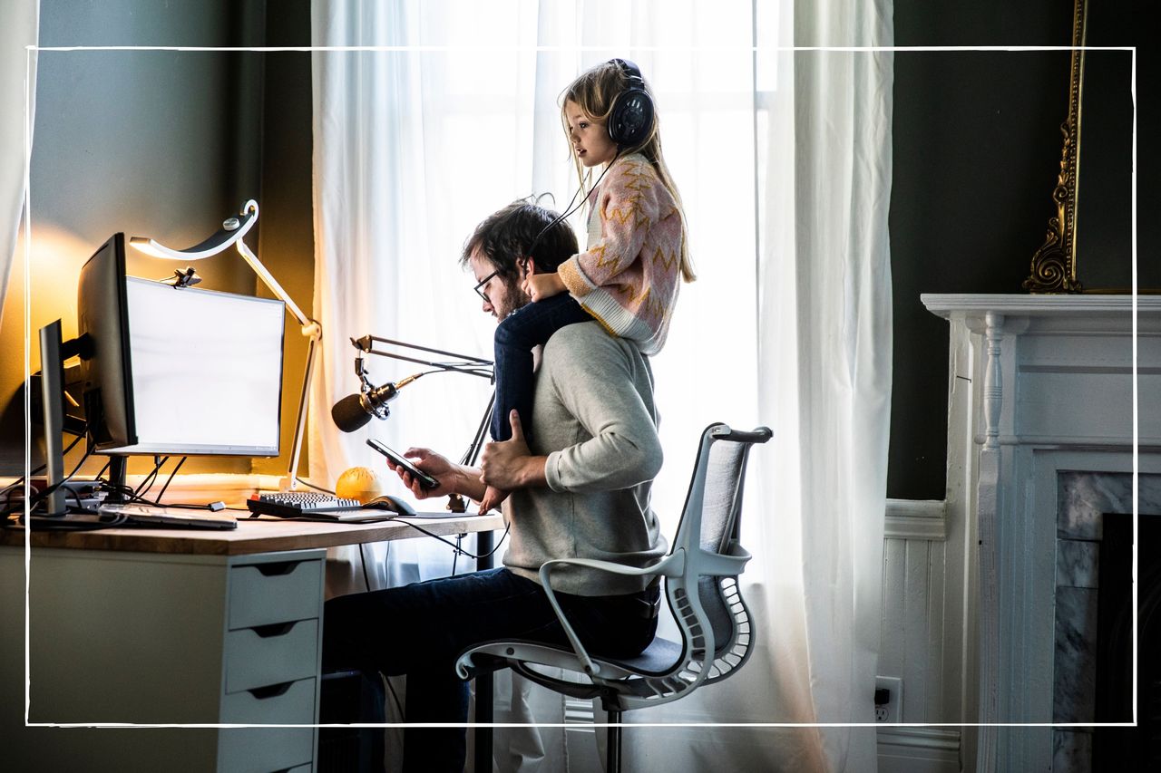 four-day working week illustrated by dad with child sat on his shoulders as he works in the evening