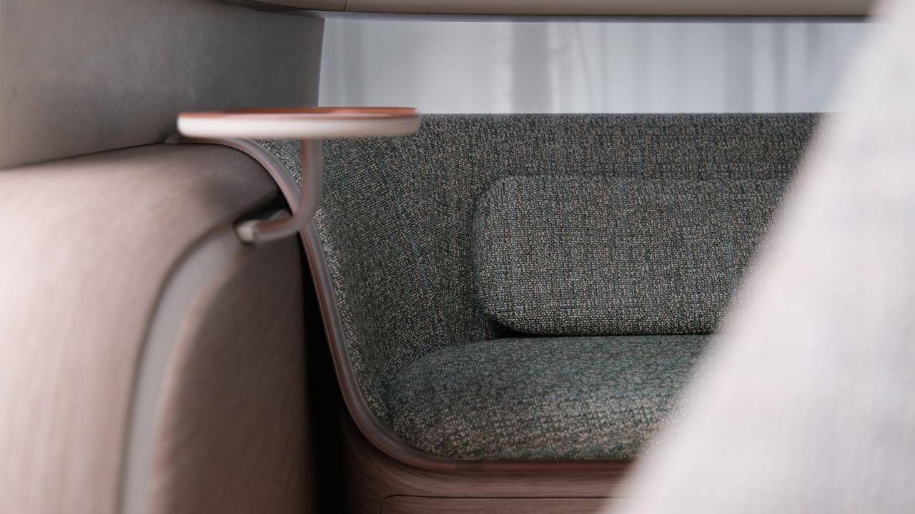 Close up on a modern, lounge-like seat in a car