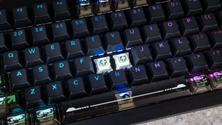 The Lemokey L5 HE keyboard on a stone surface with a gray wall in the background