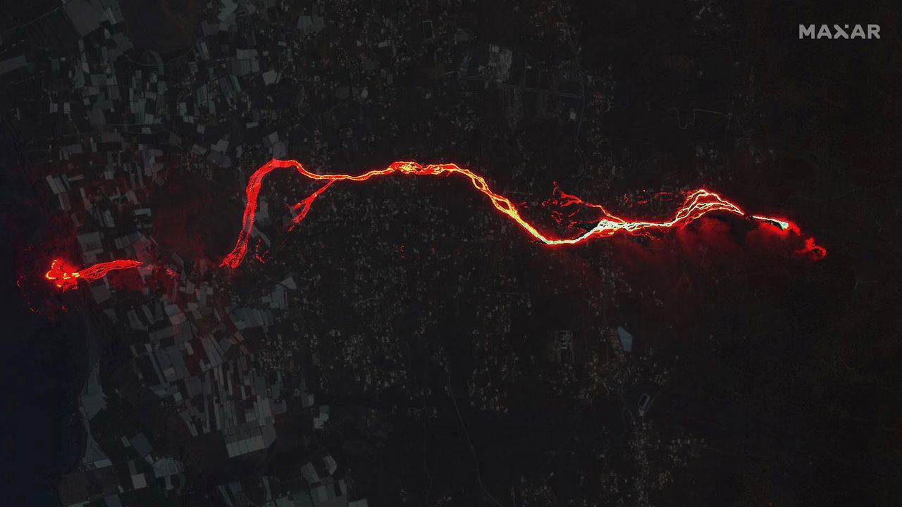 A night time image taken on Sept 29 overlaid on a daytime image from August 17 shows the river of lava flowing into the Atlantic Ocean.