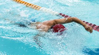 Is swimming cardio? Image shows man swimming in pool