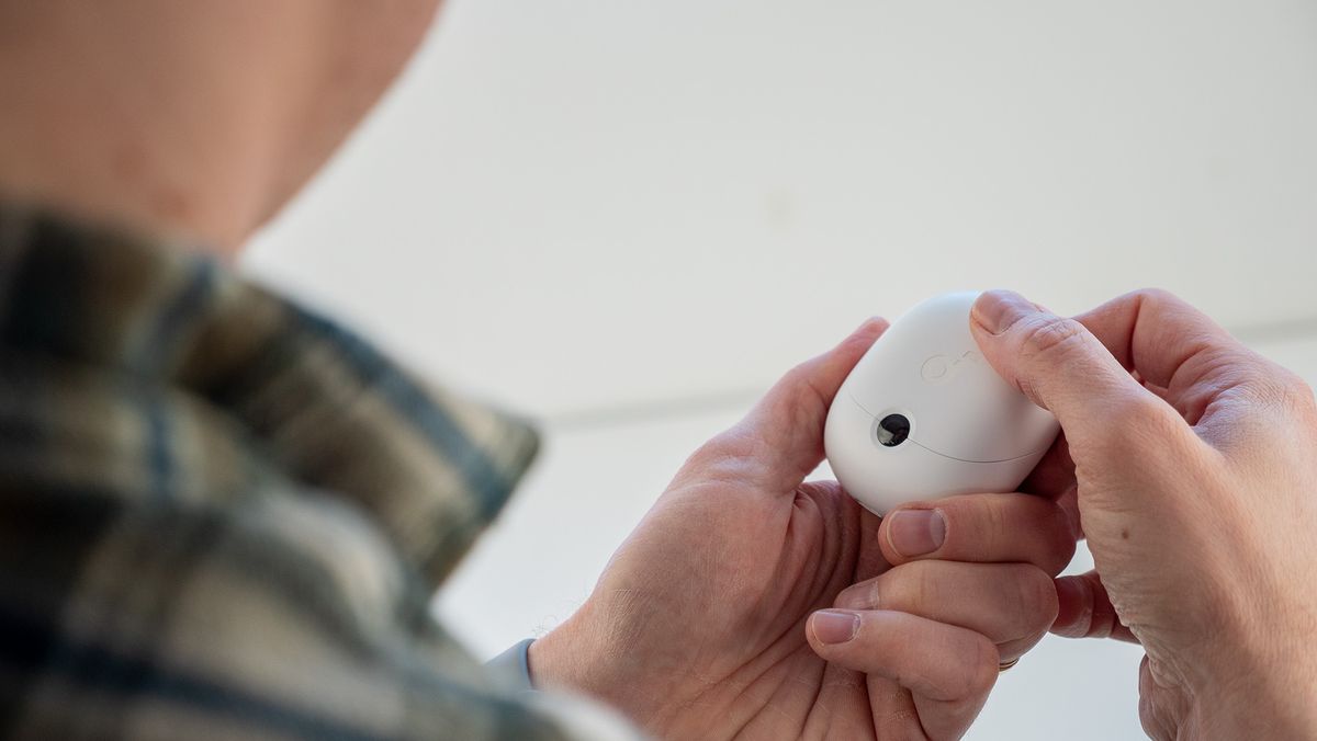 Closing the case of the Soundcore VR P10 earbuds for Meta Quest