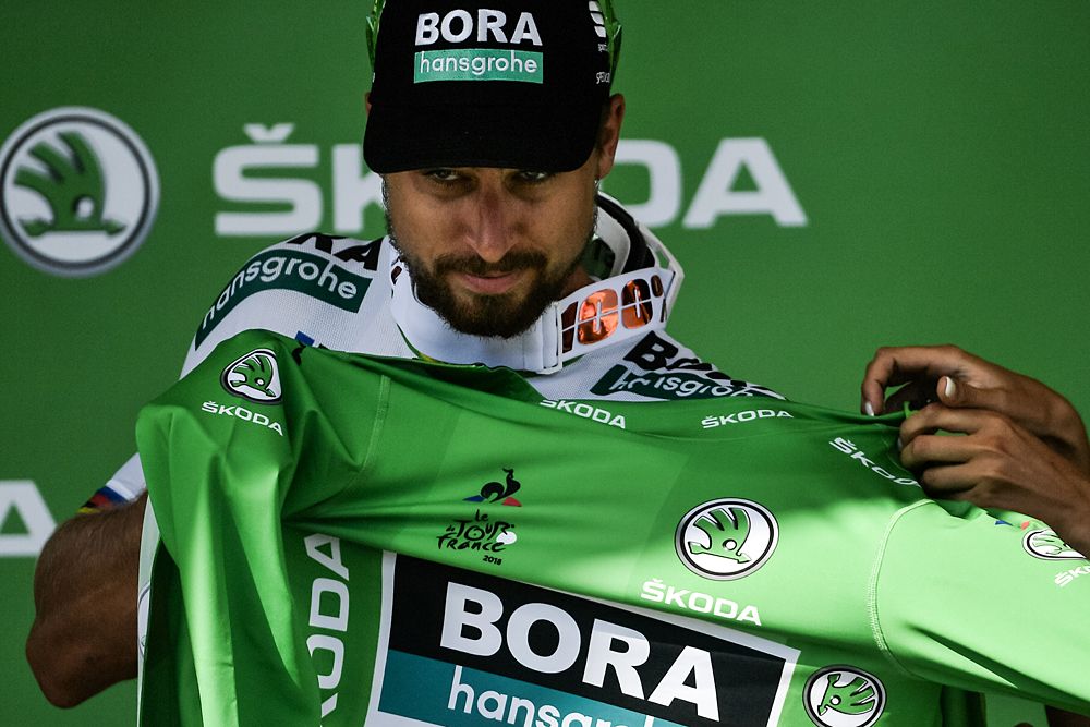 Peter Sagan (Bora-Hansgrohe) puts on the green jersey after winning stage 5 at the Tour de France