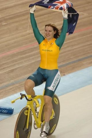 Anna Meares flies the Aussie flag high in Athens after winning the 500m Time Trial
