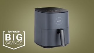 The Cosori Pro LE Air Fryer L501 on a khaki green background