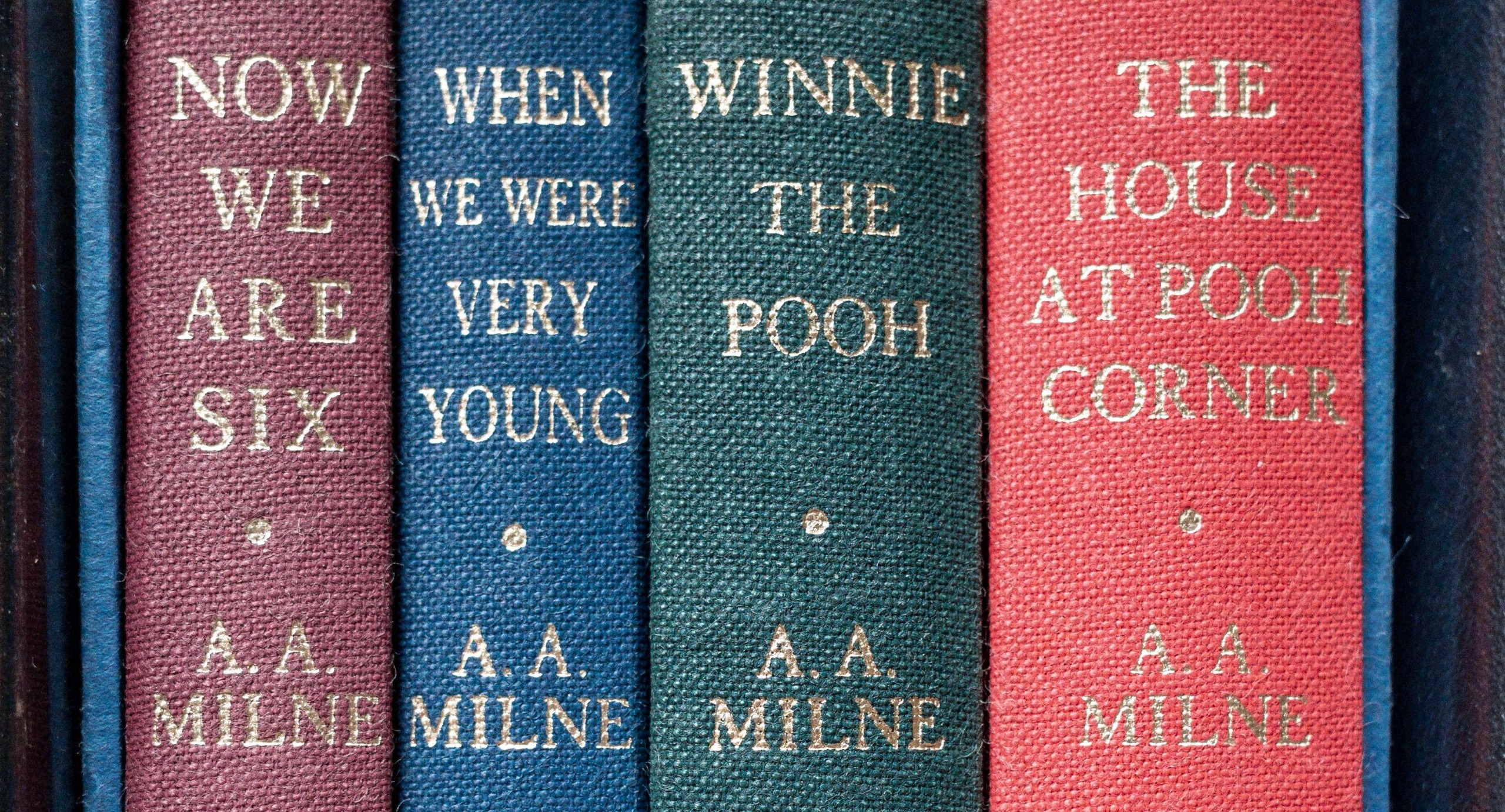 a close up of a row of Winnie the Pooh books