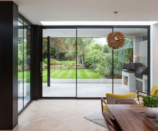 Interior shot of sliding doors looking out onto a well-groomed garden