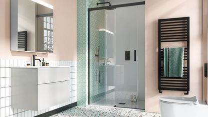 green and pink bathroom with large shower and towel rail