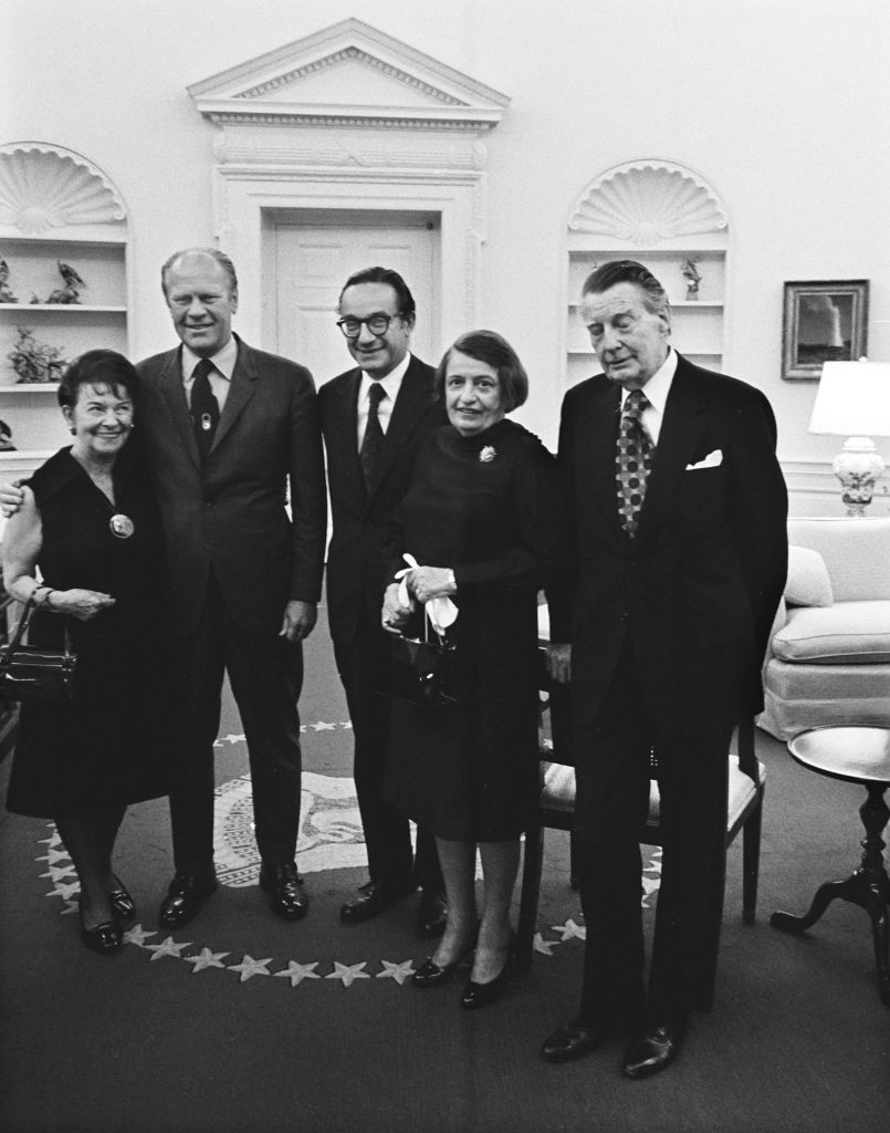 Greenspan's mother Rose Goldsmith, President Gerald R. Ford, Alan Greenspan, writer Ayn Rand, and her husband Frank Connor after Greenspan's swearing in as Chair of the Council of Economic Advisors.